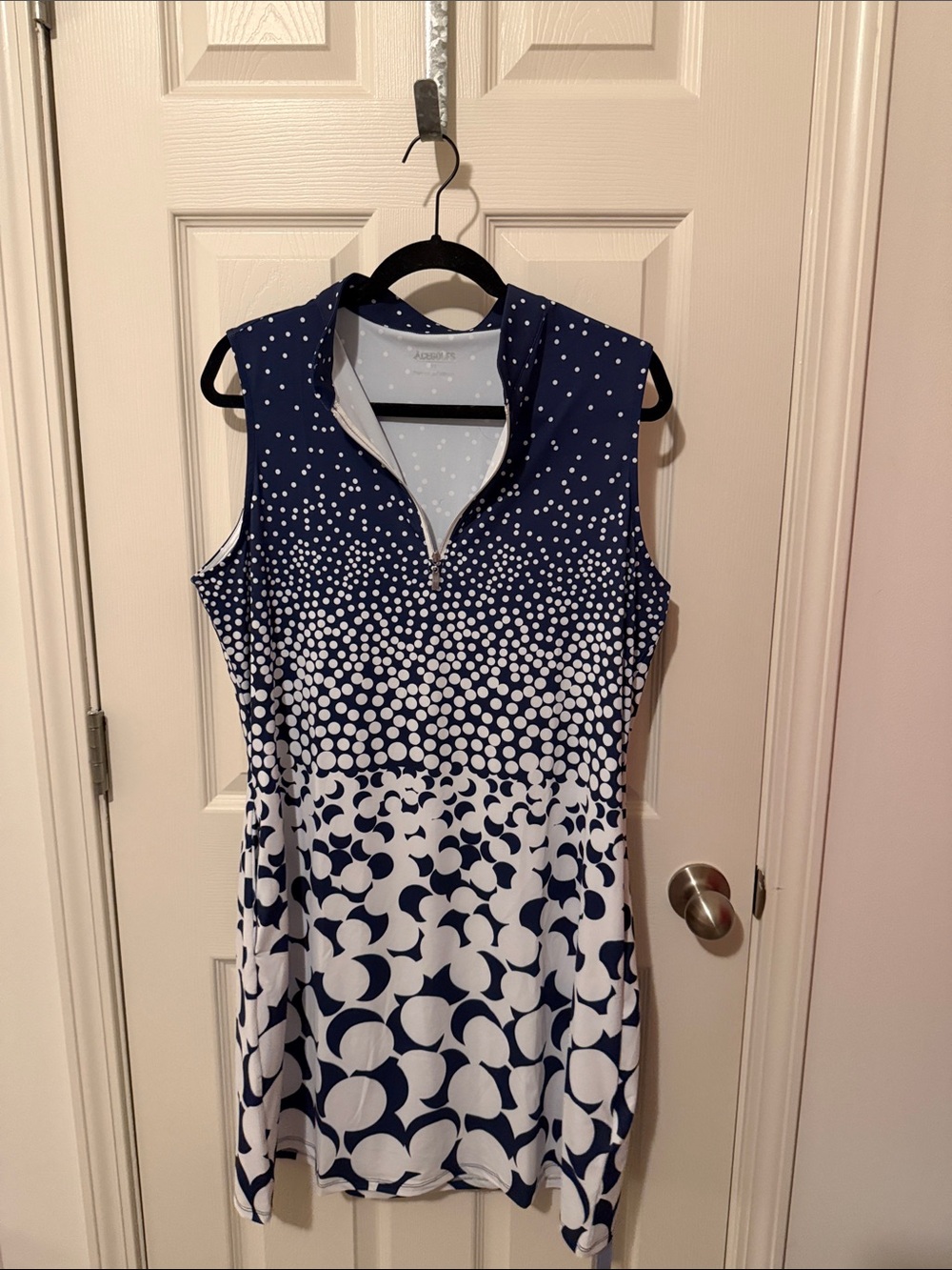 Sleeveless Navy Dot-Print Mini Dress with Zip Neck
